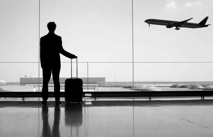 Passenger in airport transferred by luxury chauffeur